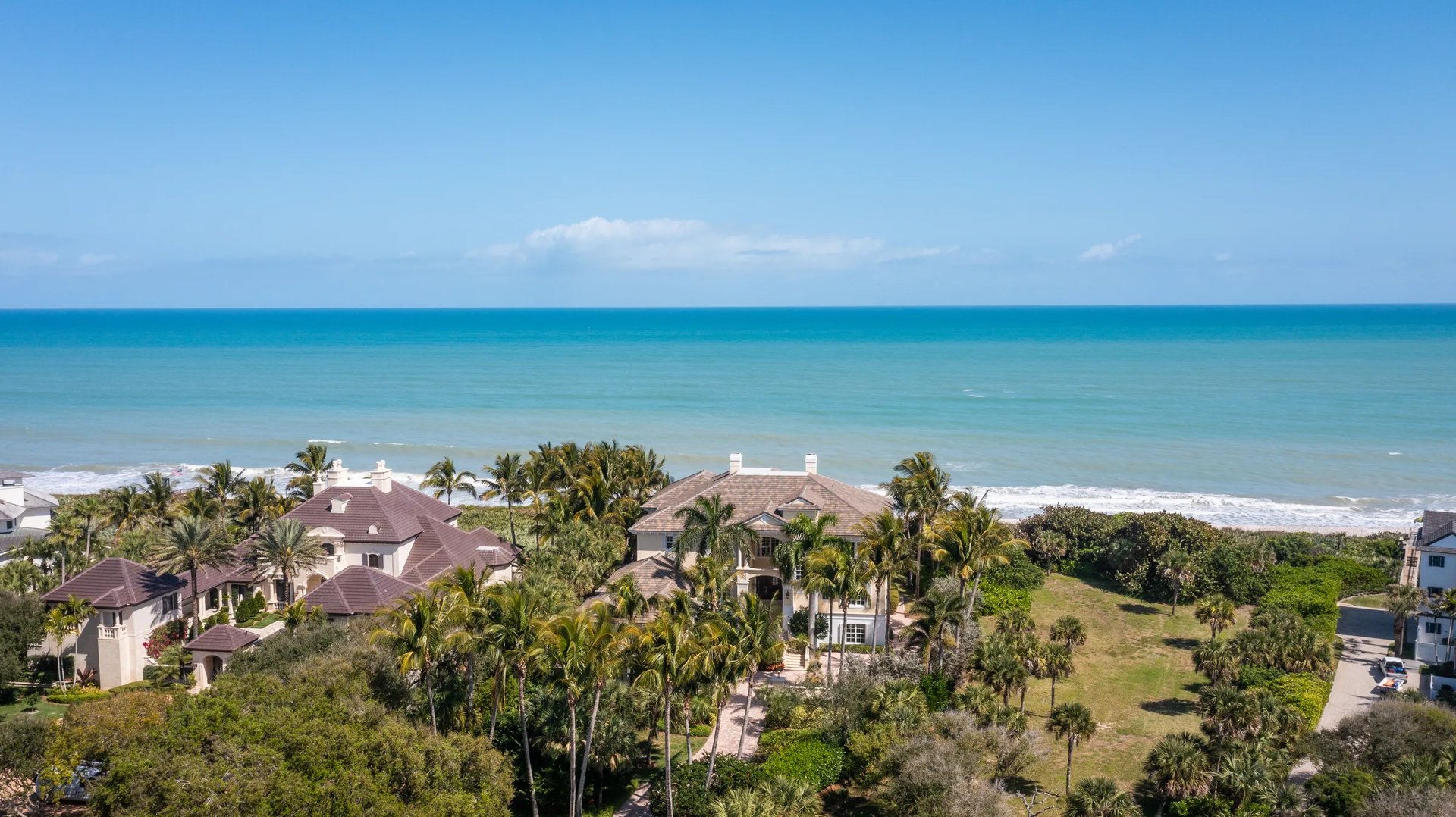Aerial of an oceanfront estate on the Vero Beach barrier island with the Atlantic shoreline beyond