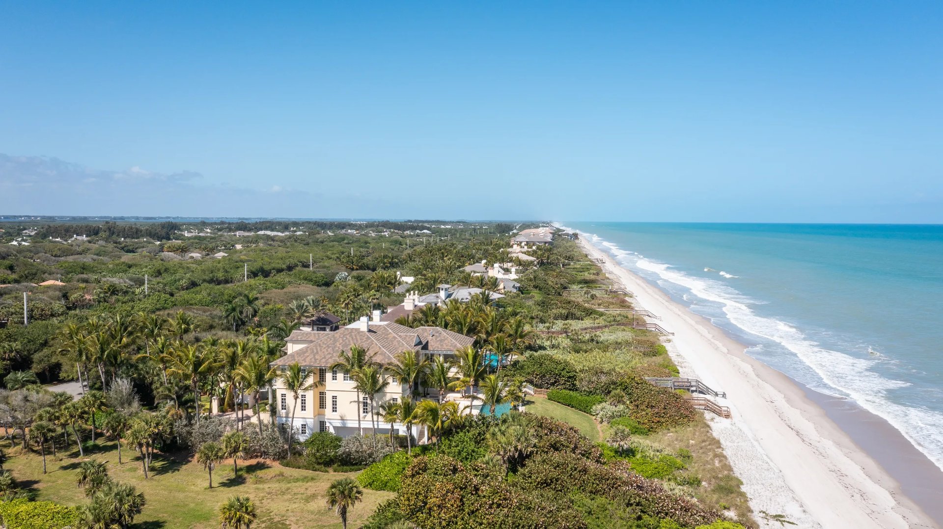 Aerial of an oceanfront lot on a Florida barrier island showing frontage, lot depth, dune line, and Atlantic shoreline