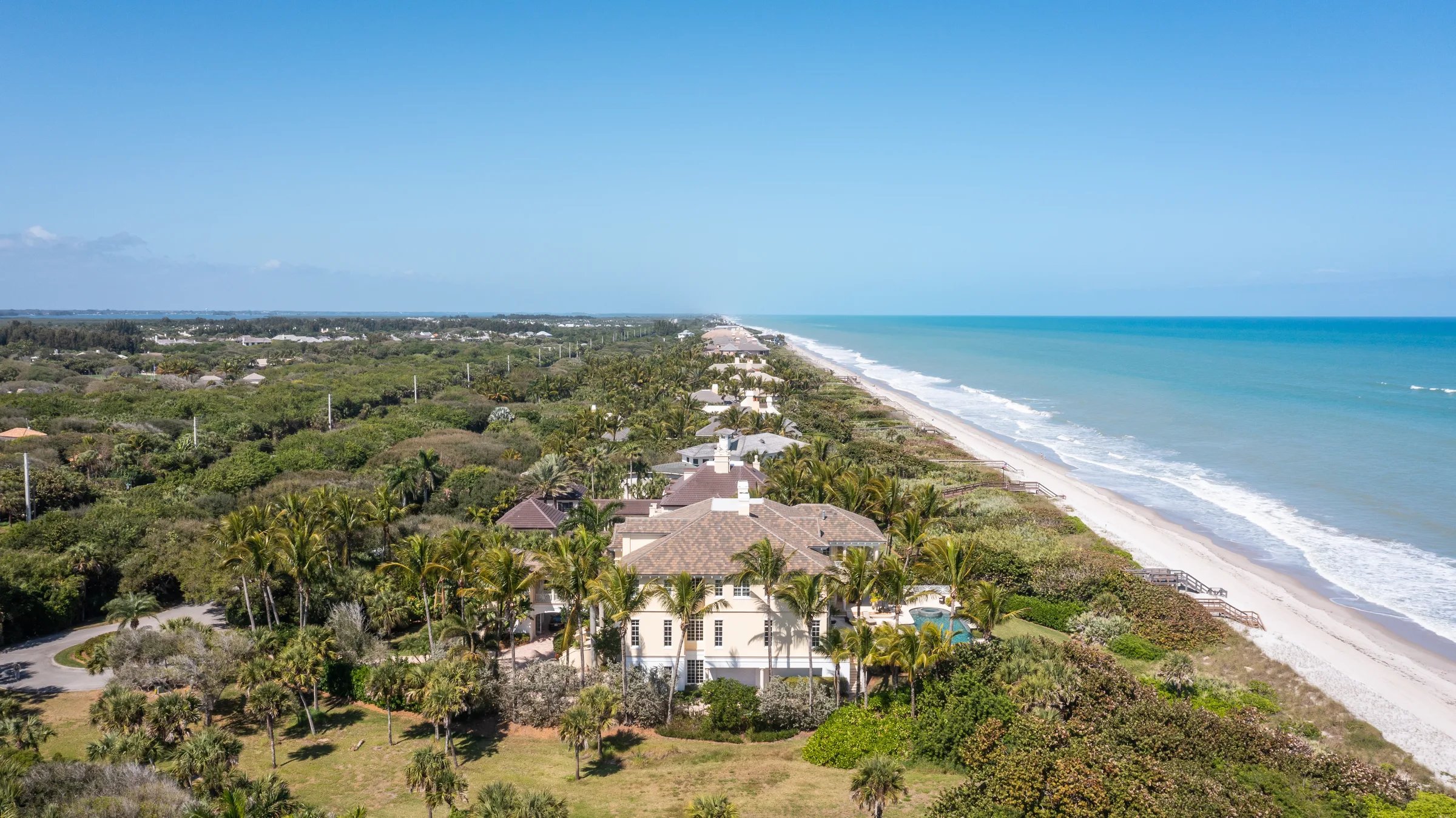 Aerial of 211 Beachside Drive along 122 feet of Atlantic shoreline in Orchid, FL