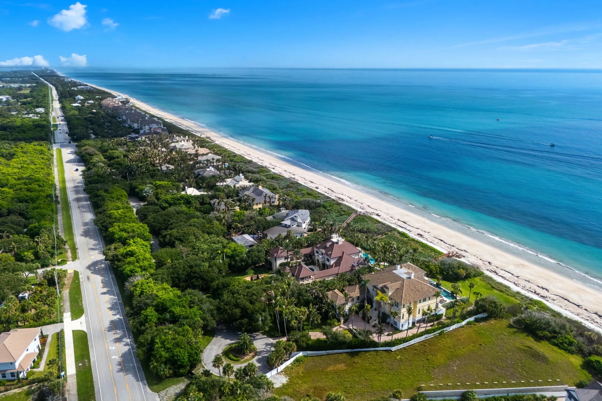 Aerial view north along A1A coastline with the estate centered on the dune