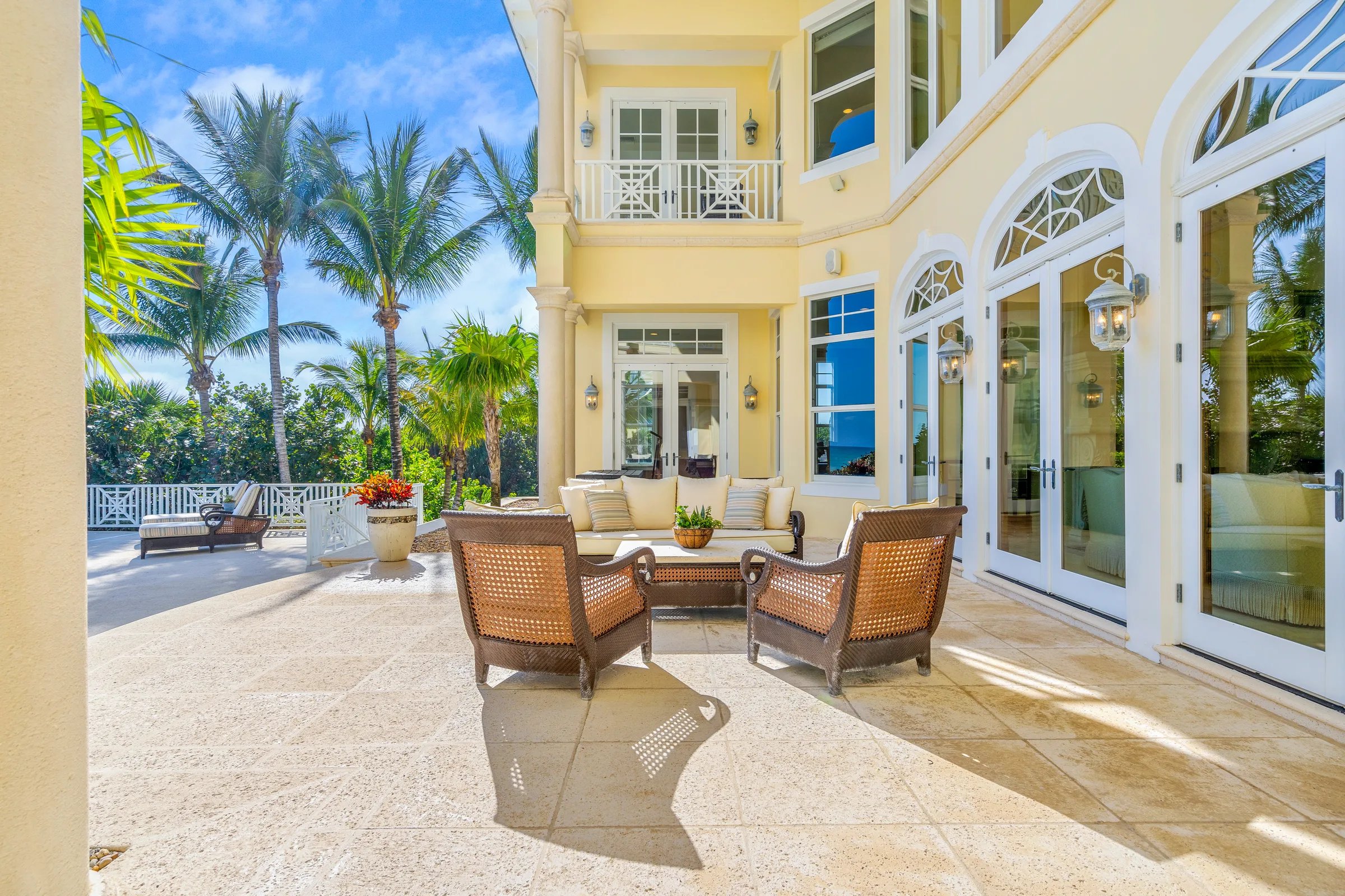 Covered patio with yellow stucco