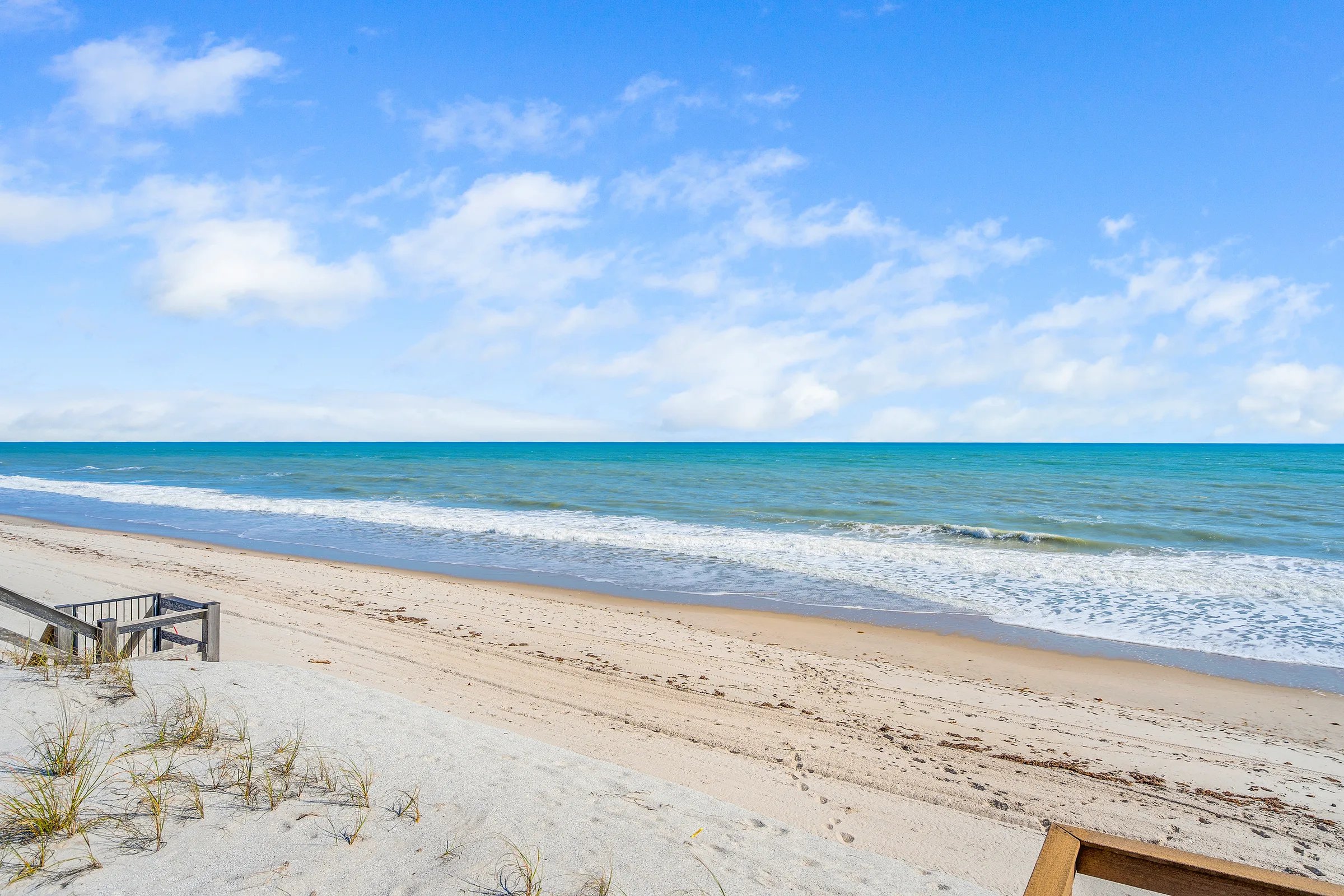 Beach bench with calm surf
