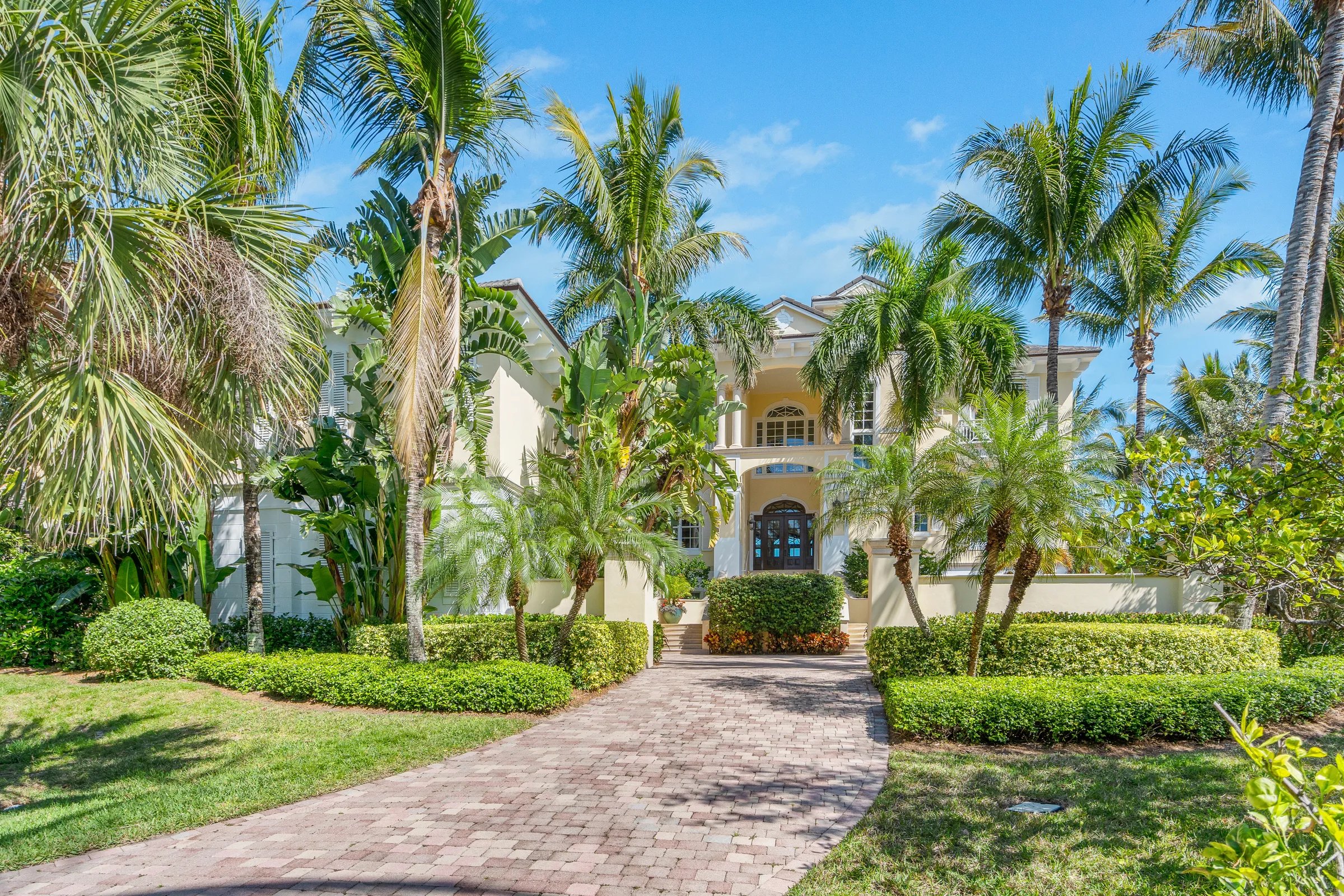 Driveway through tropical landscaping to 211 Beachside Drive, Orchid Island, Orchid FL