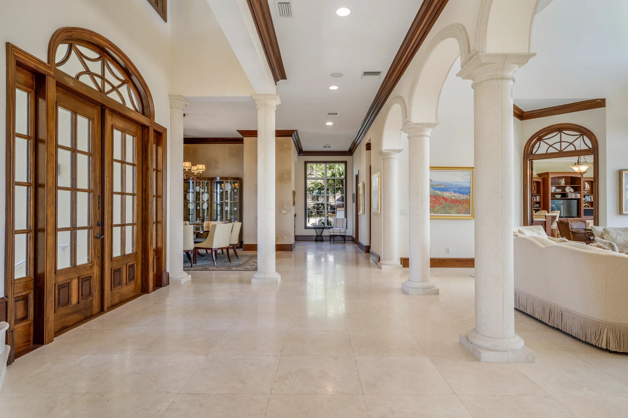 Foyer looking back at the front doors with arched fanlight