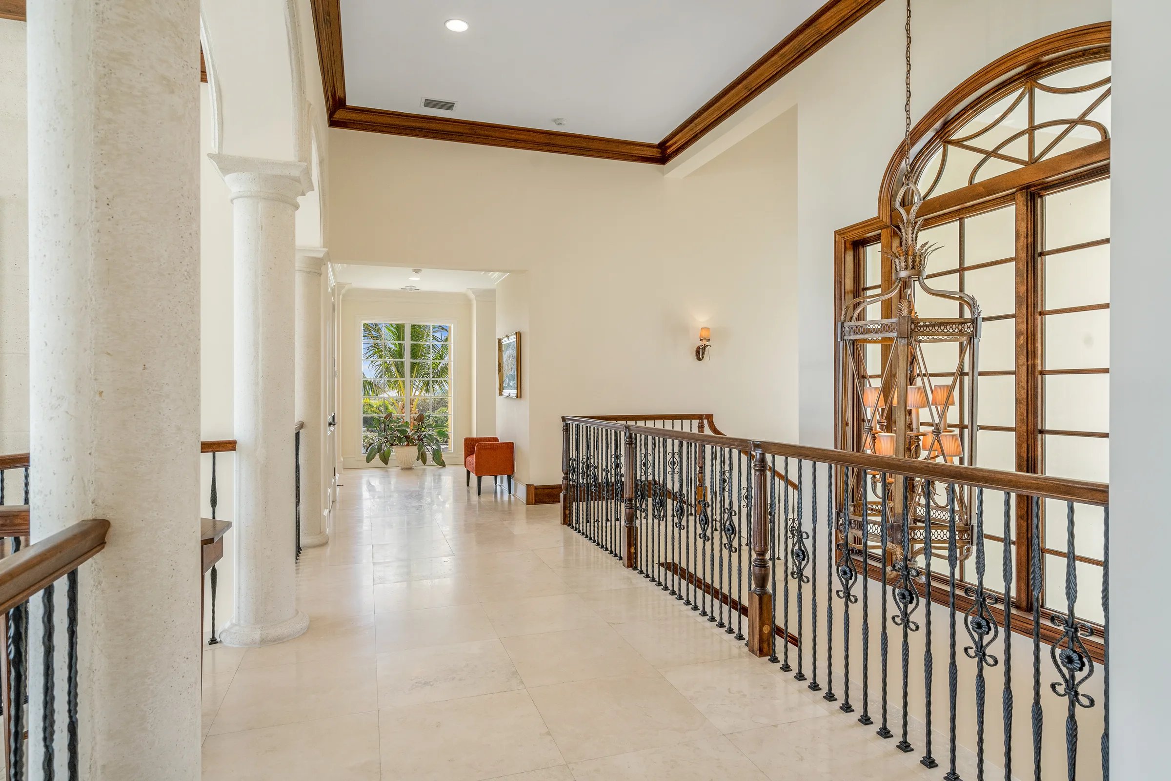 Second-floor gallery with iron railings
