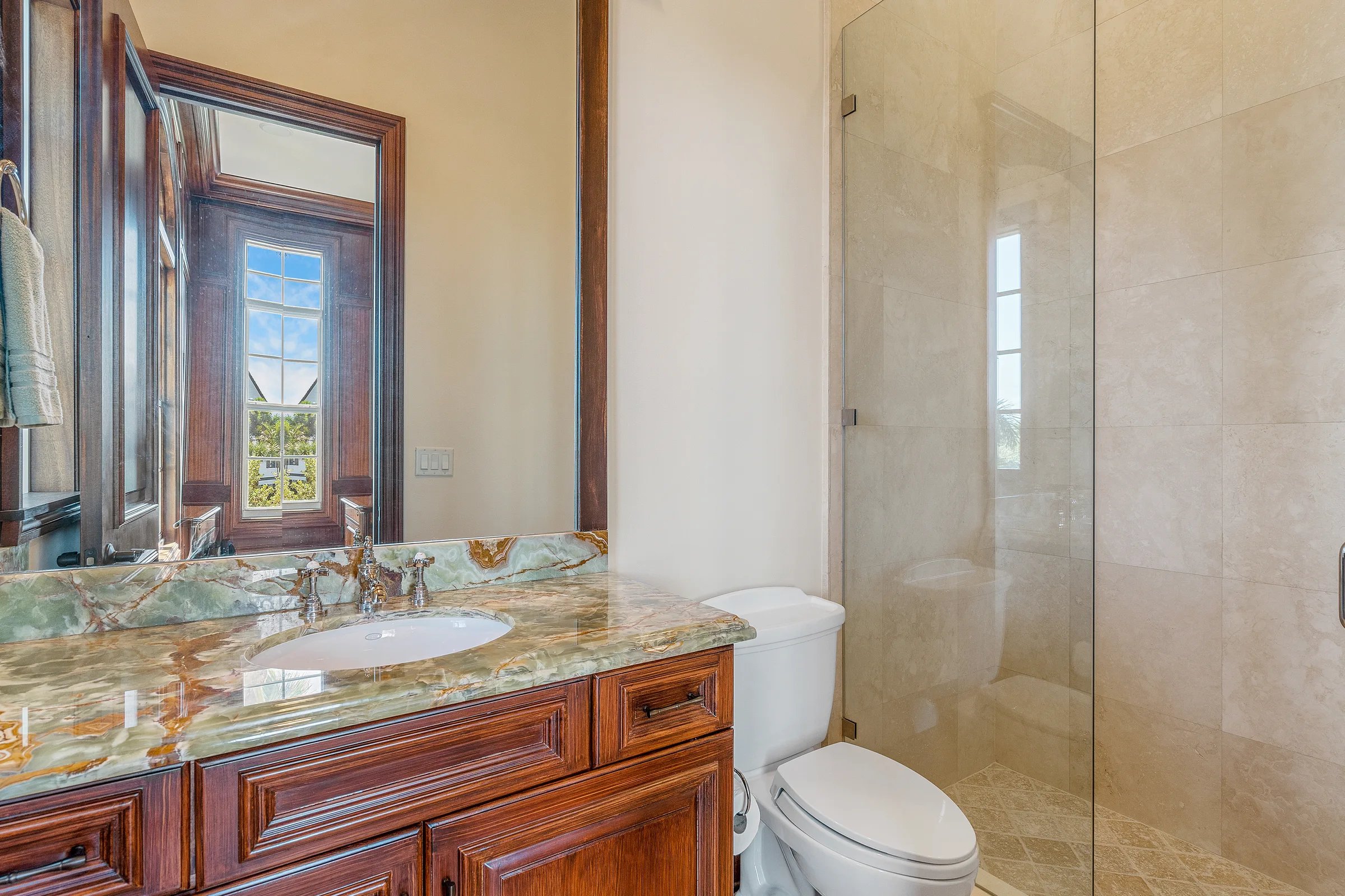 Guest bath with carved wood vanity