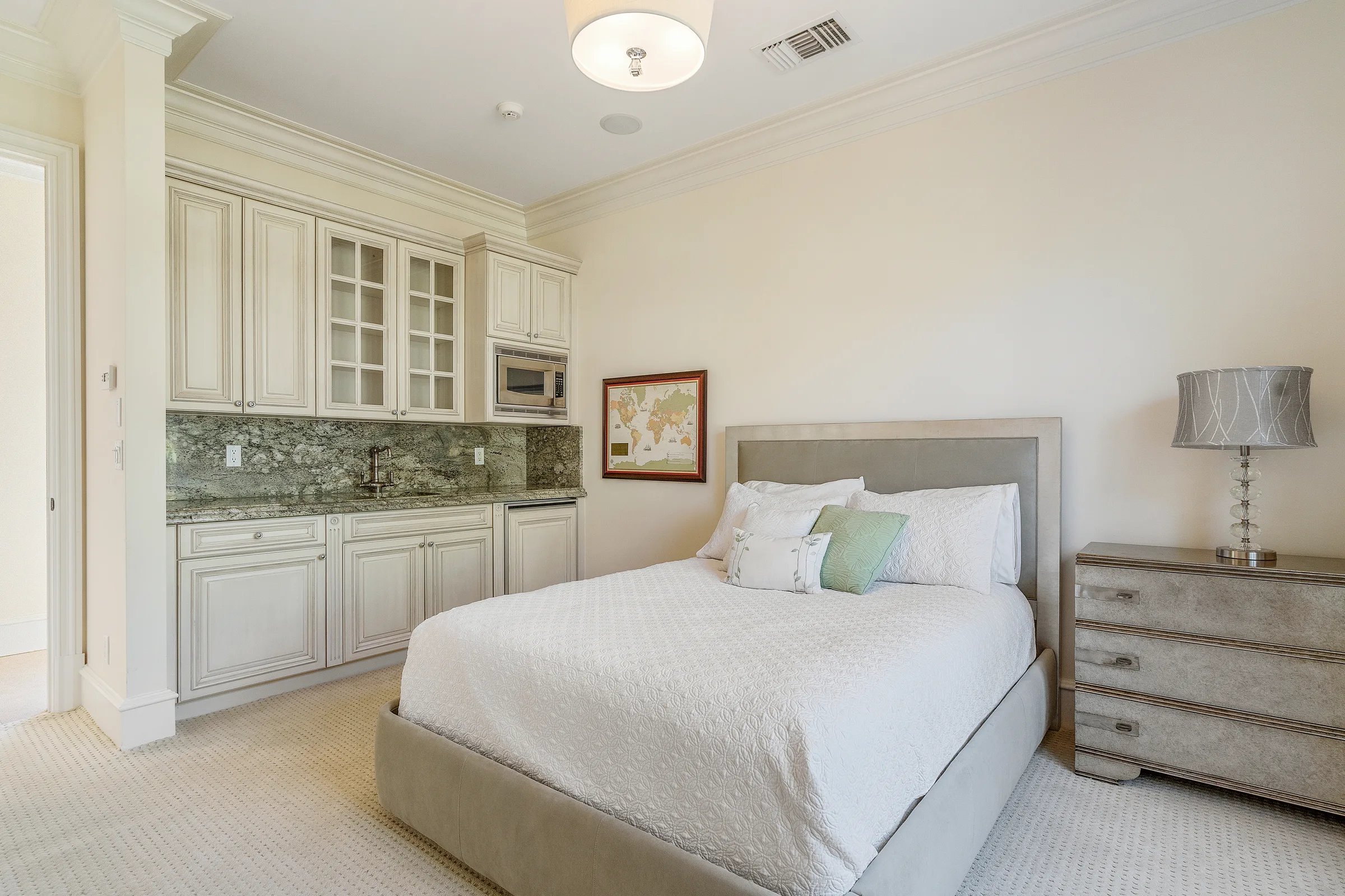 Beige queen-bedded guest room