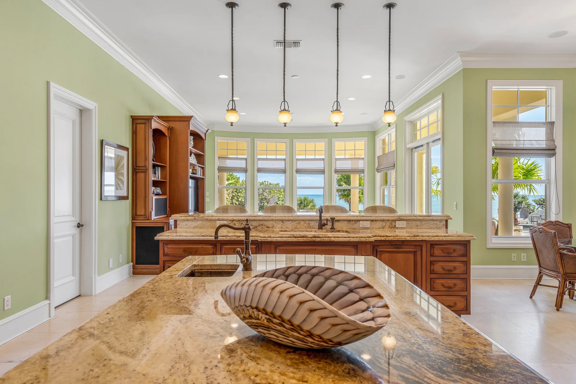 Secondary island with paneled fridge