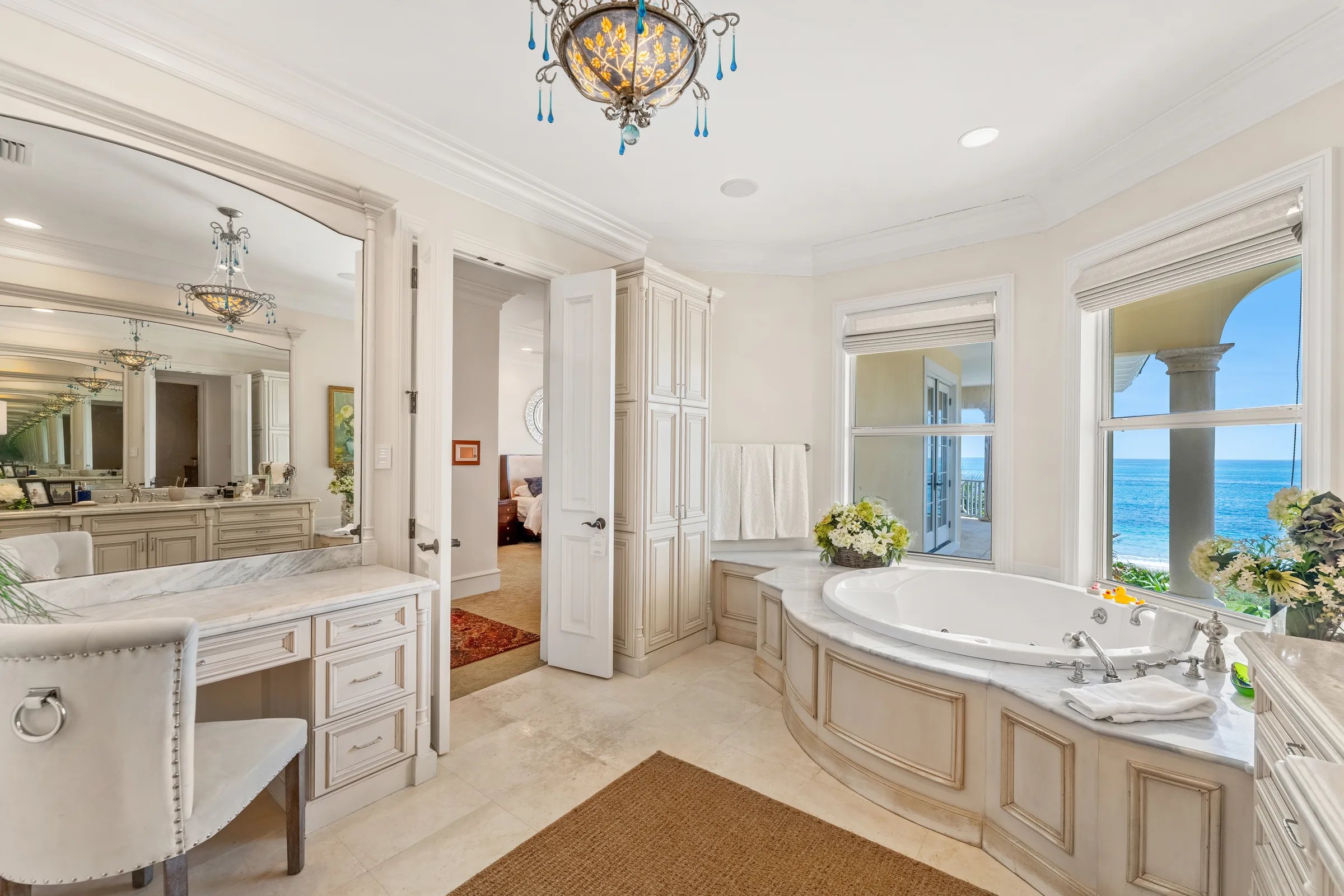 Owner bath soaking tub set in arched bay overlooking the Atlantic
