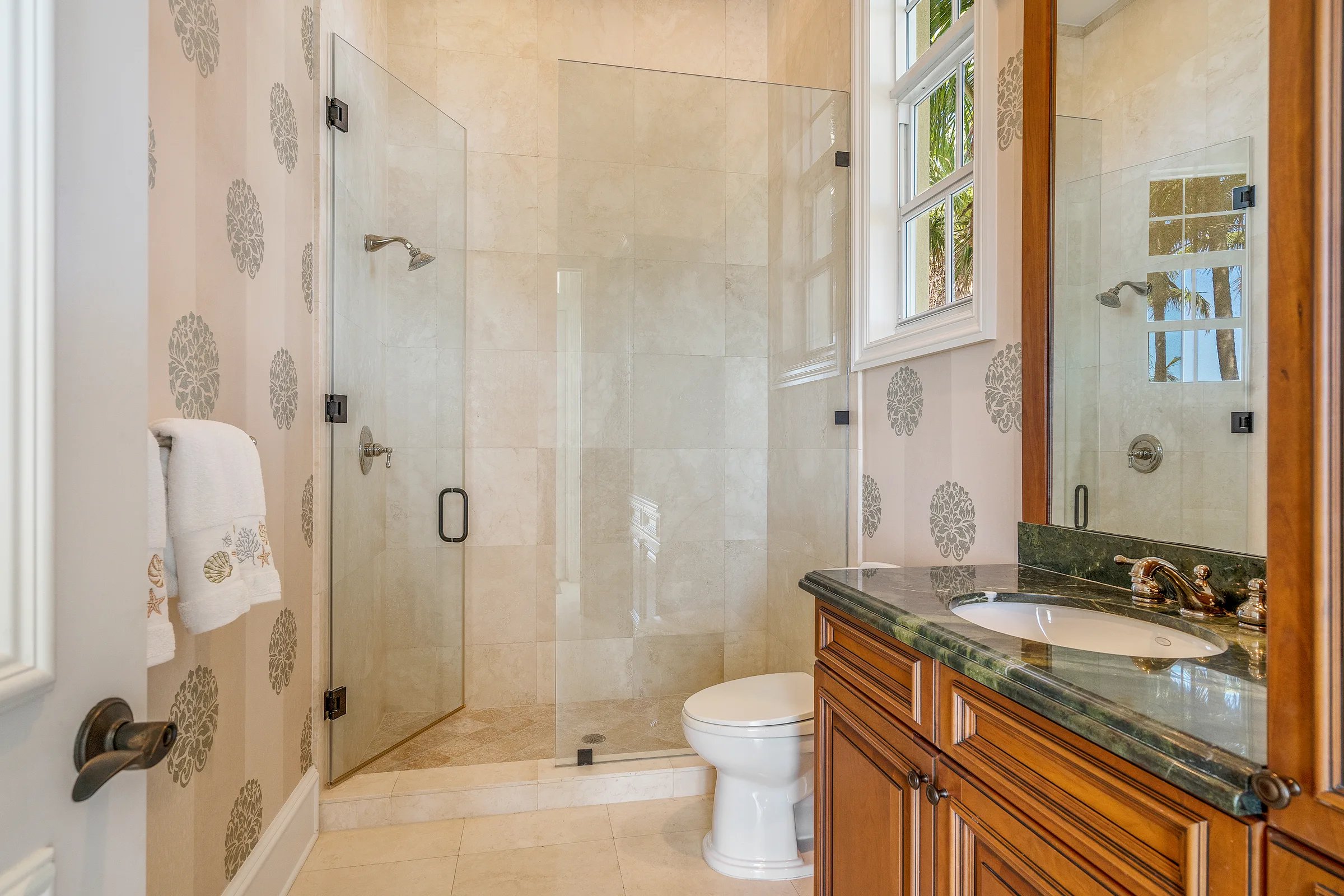 Powder room with floral wallpaper